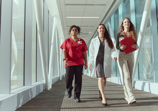Medical team walking through hallway