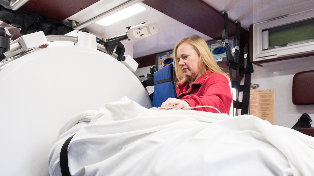 Medical provider with the mobile unit attends to a patient's needs. 