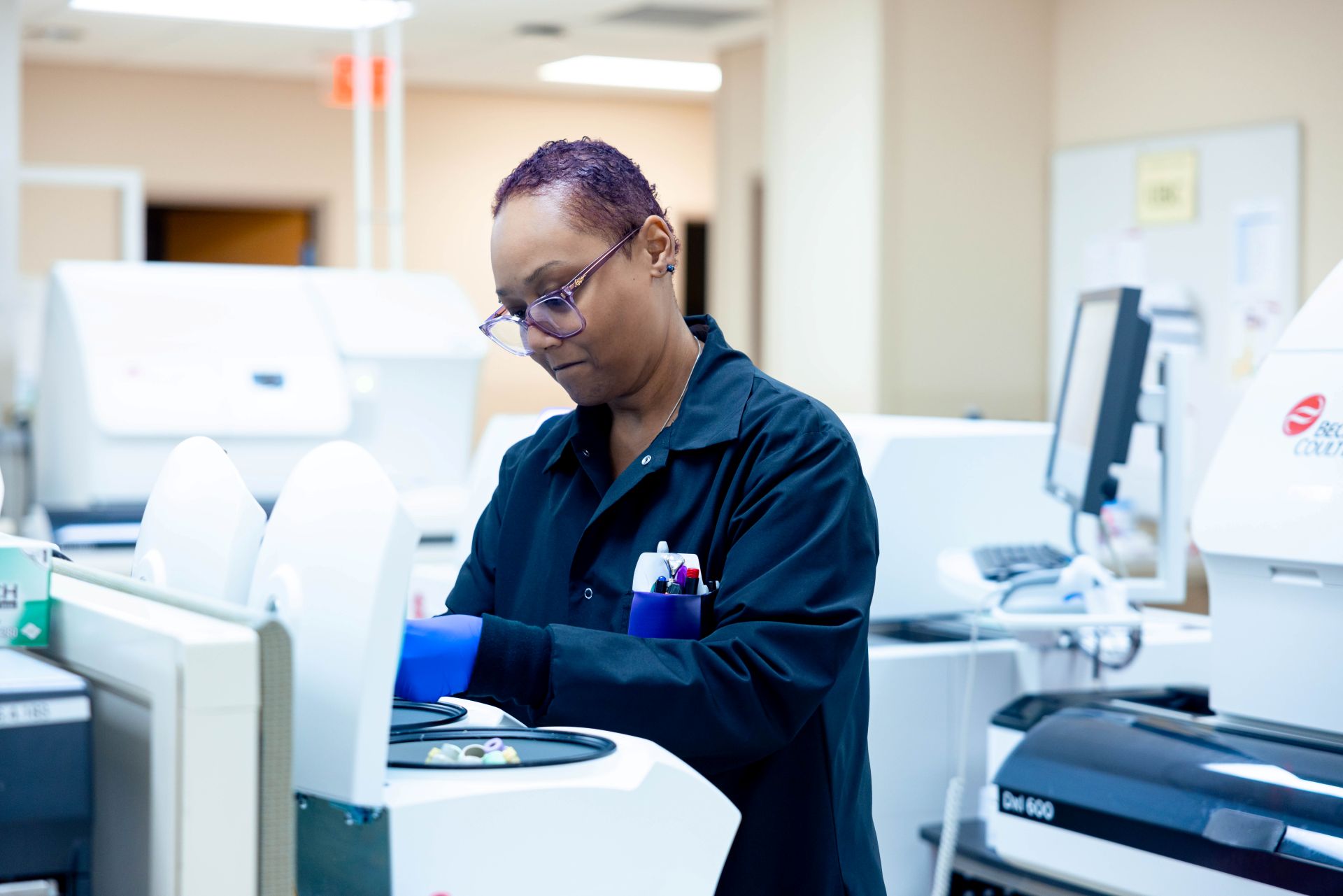 Specialist in lab works with equipment. 