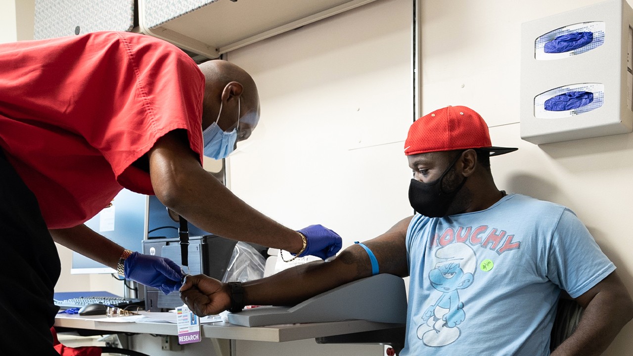 Jarelle Marshall recieving the COVID-19 vaccine