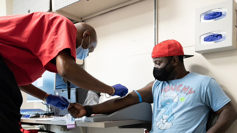 Jarelle Marshall recieving the COVID-19 vaccine