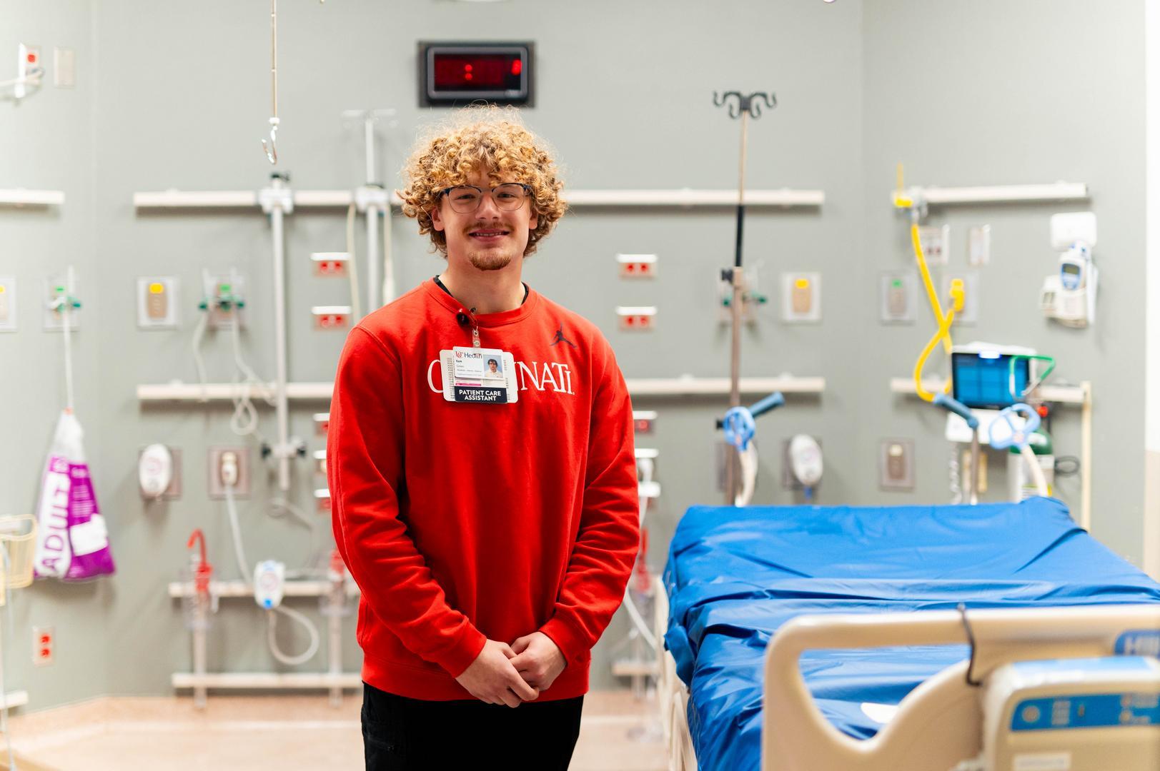 Medical assistant smiles in patient room 