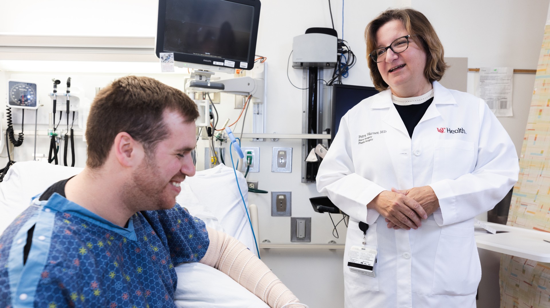 Dr. Warner consulting a patient about spray-on autologous skin cells treatment.