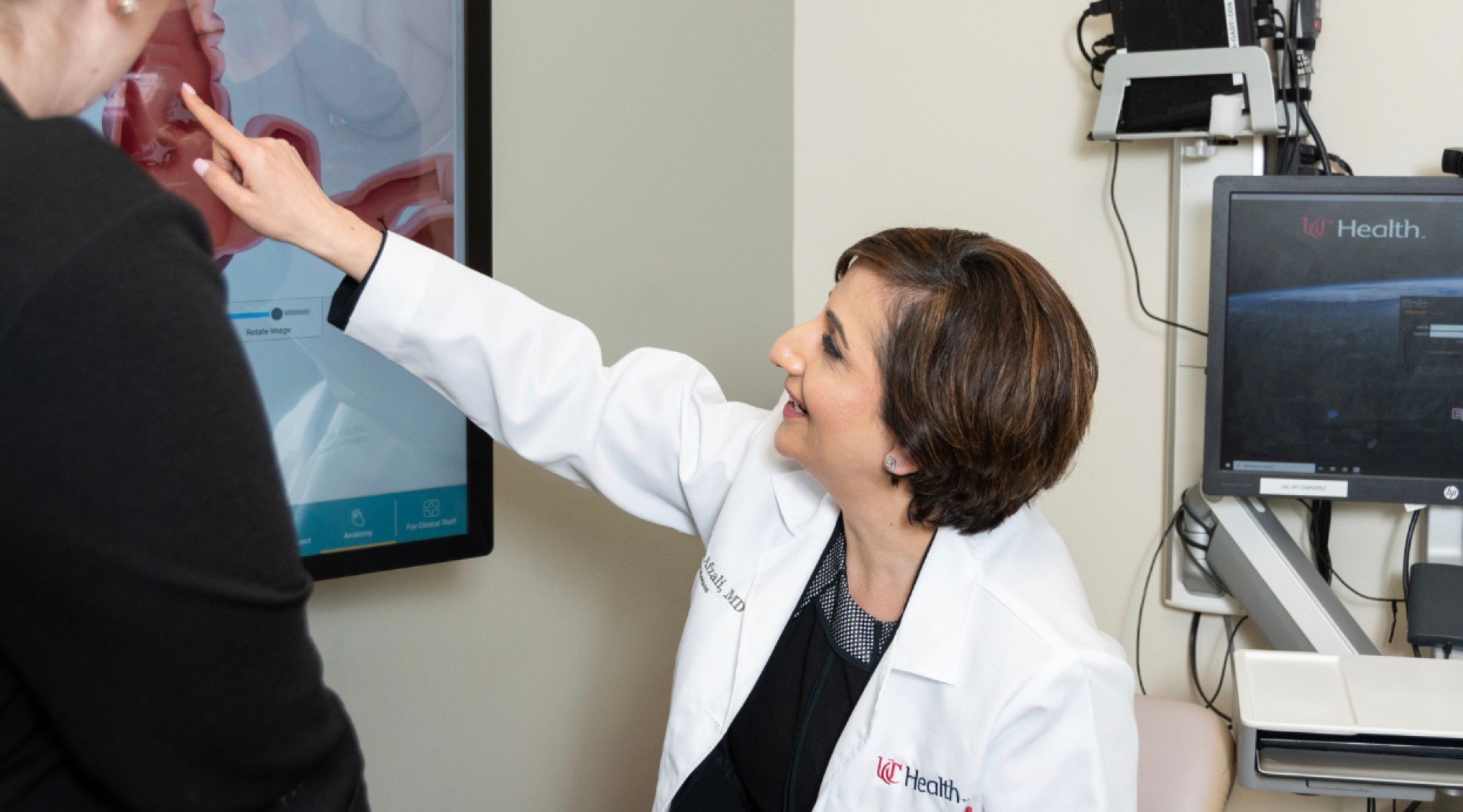 Dr. Anita Afzali educating a patient. 