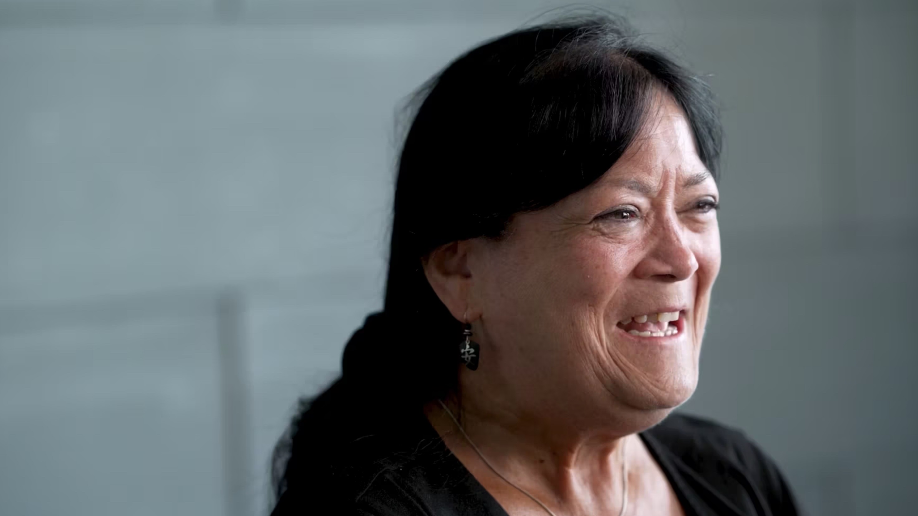 Patient, Gina, smiling.