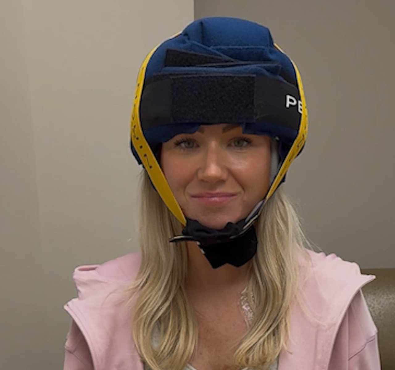 Brittany demonstrates the cold cap she is using as part of her cold capping treatment