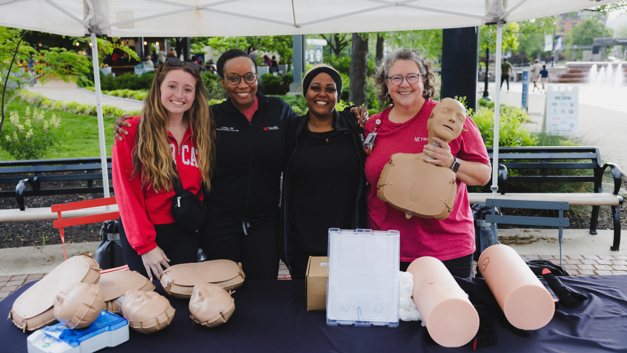 Team Members from UC Health demonstrate life-saving CPR techniques at 513 Day in Cincinnati, Ohio