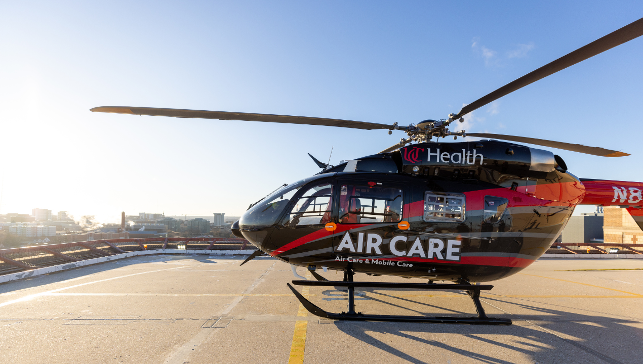 UC Health's Air Care and Mobile Care helicopter landing on a helipad