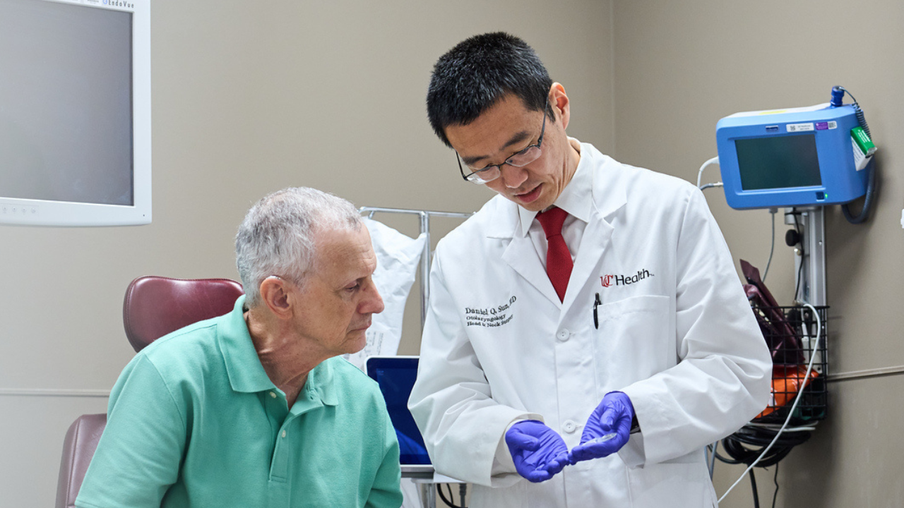 Dr. Sun and patient meet in exam room