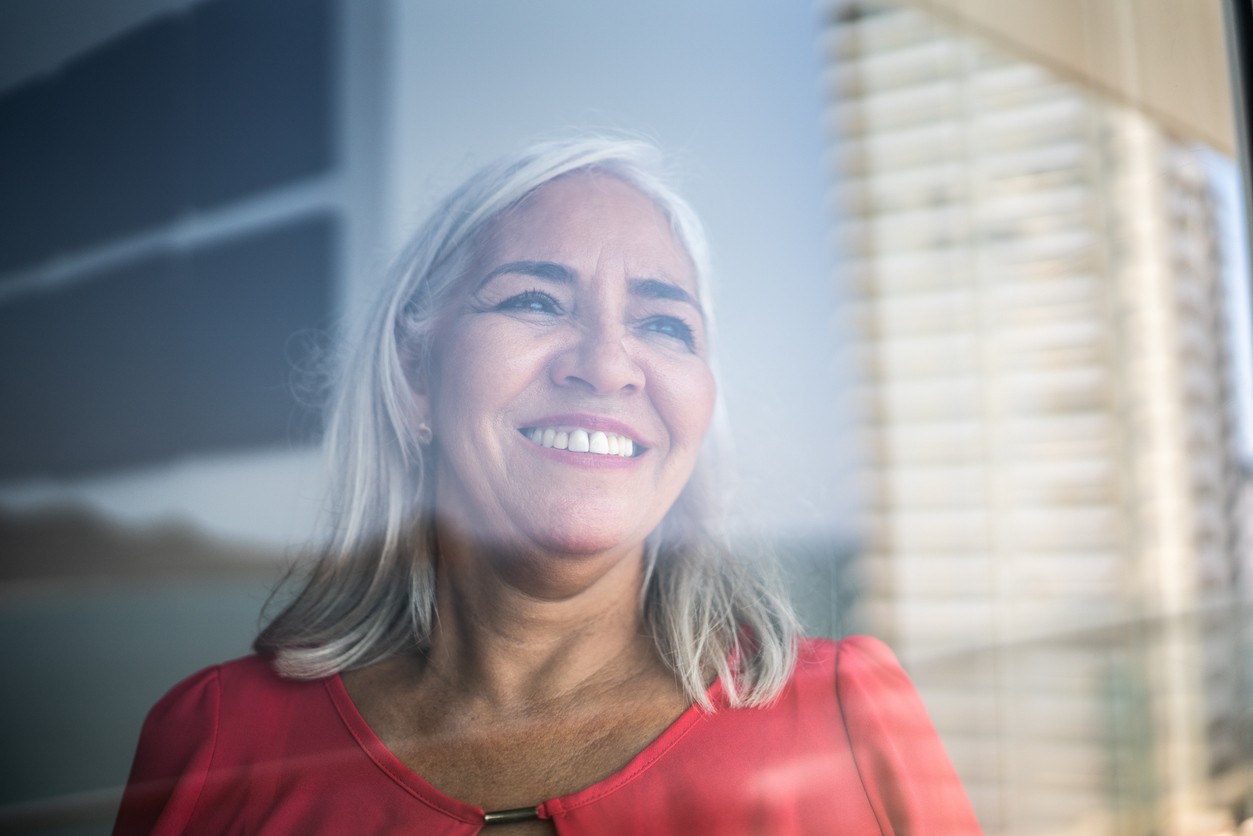Woman gazes out the window