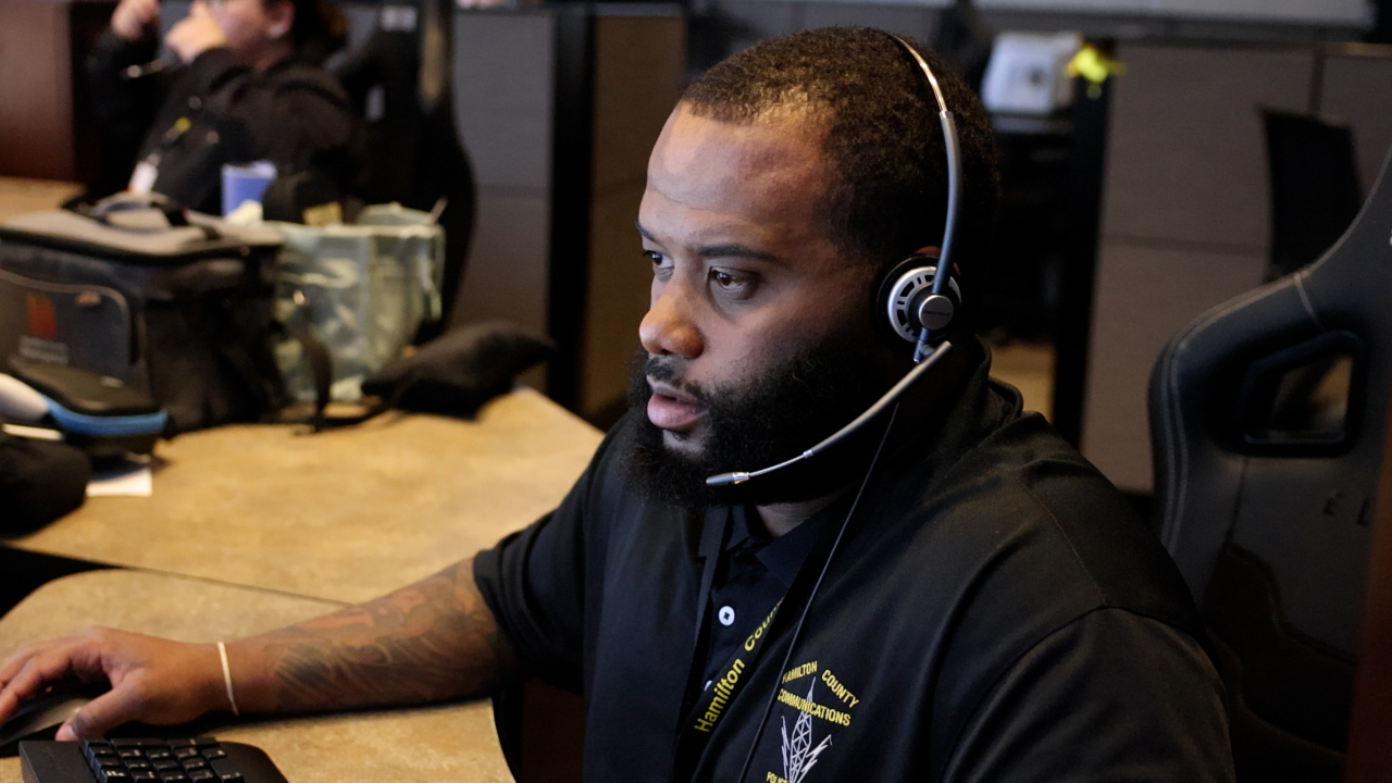 911 dispatch officer takes call from dispatch center in Hamilton County