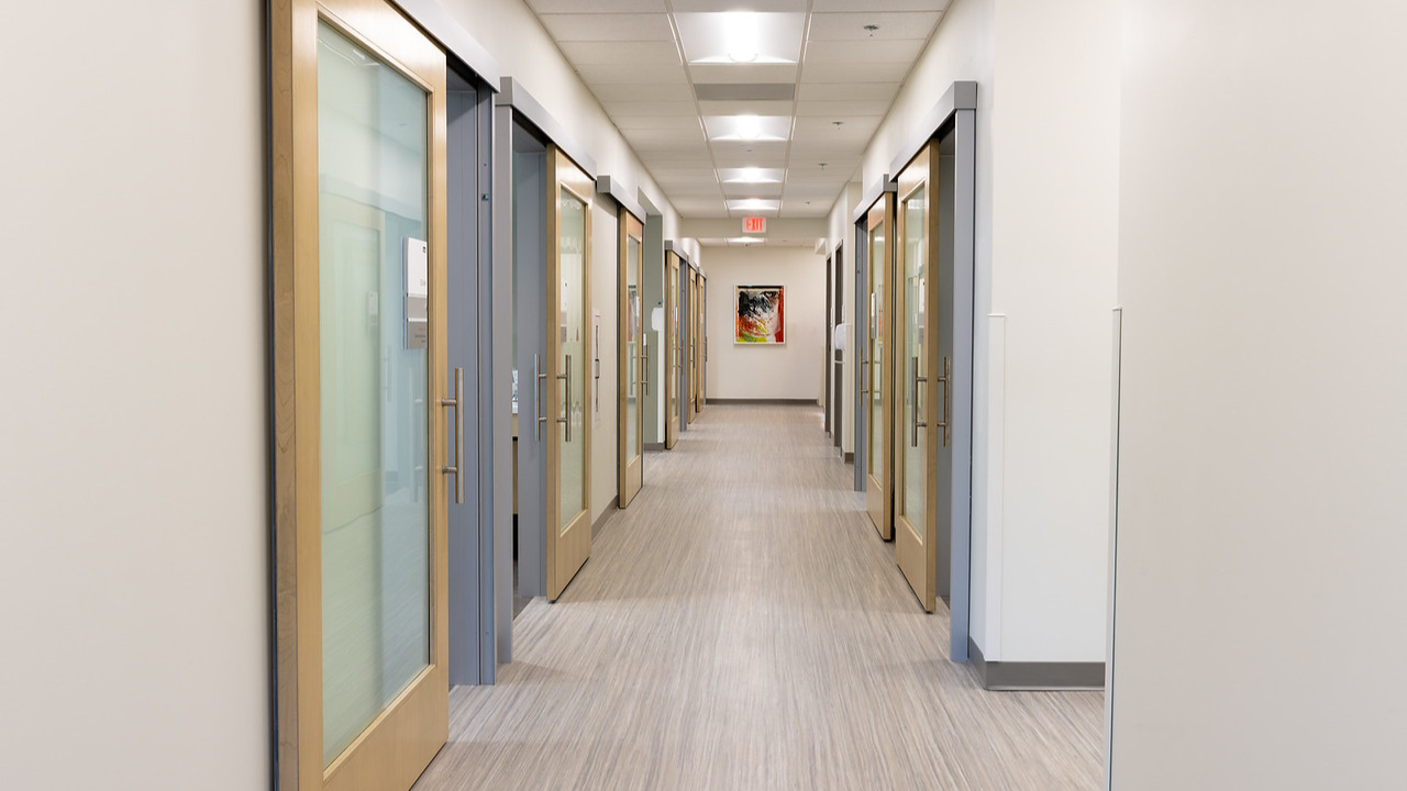 Extra-wide, clean hallways allow patients and caregivers to access spacious exam rooms at the Freeman Center in Cincinnati, Ohio.