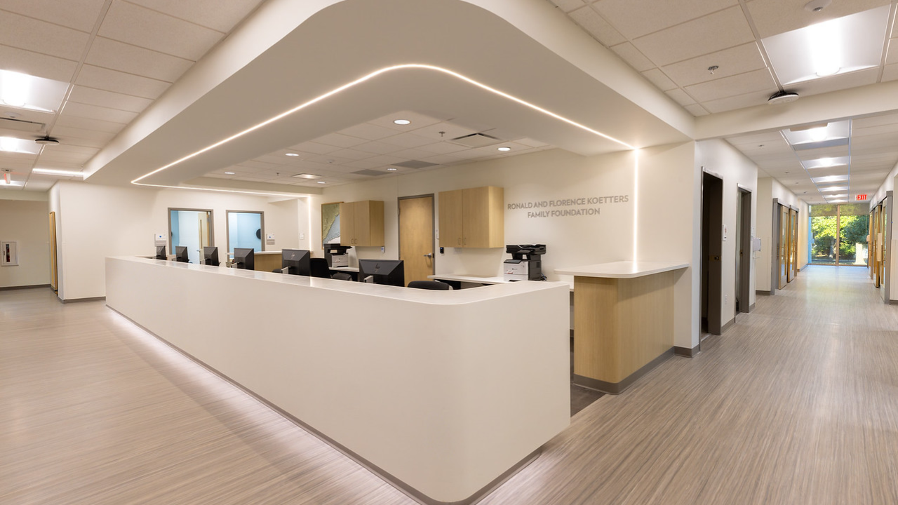 Freeman Center's nurse station showing a large, clean, centralized workstation with wide hallways.