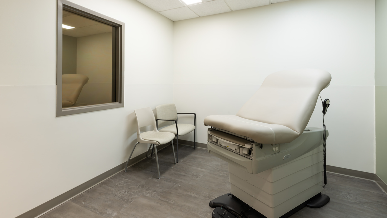 Observational room showing patient exam table and two chairs at the Freeman Center in Cincinnati, Ohio