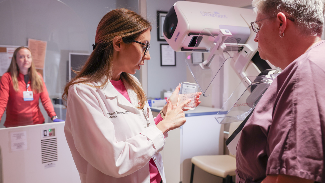 Technologist reviewing breast imaging