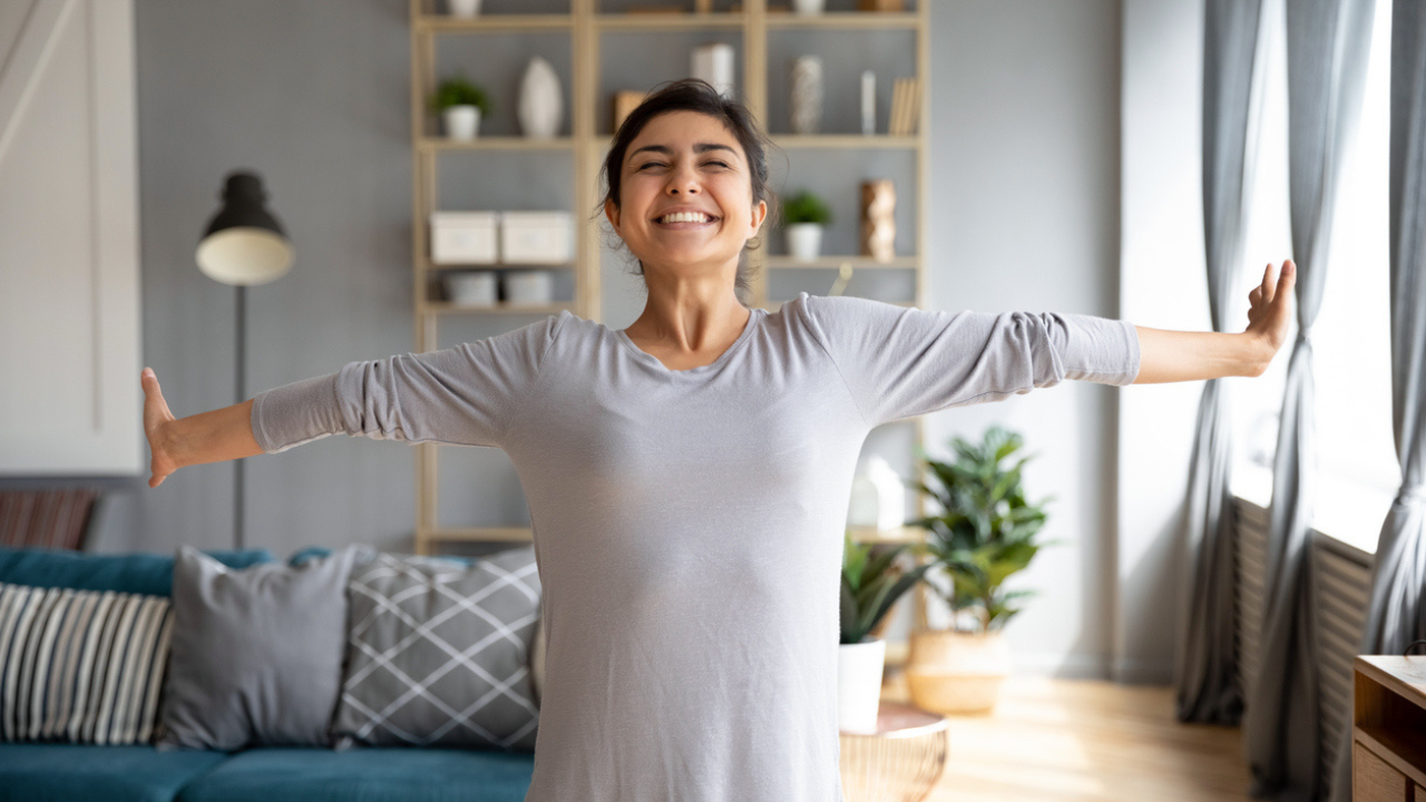 Woman stretches in her home