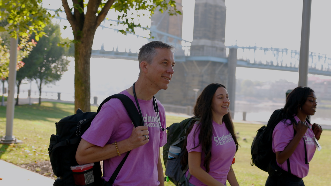 UC Health Street Medicine Team walks along the Cincinnati riverfront to meet patients