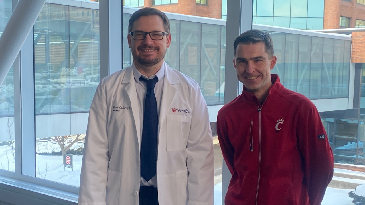 Dr. Callow and Adam stand together for a photo at UCGNI in Cincinnati, Ohio