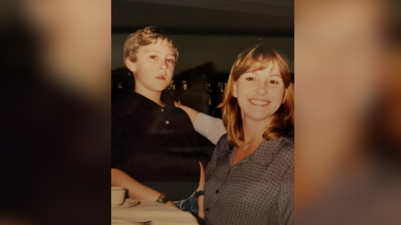 Adam and his mom as a young child