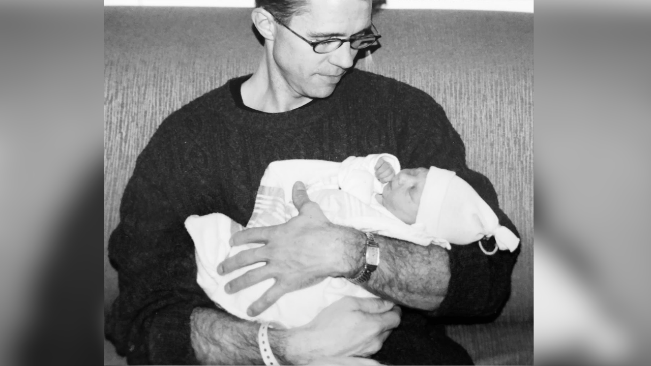 Adam's father holds him as a newborn. | Photo provided by patient