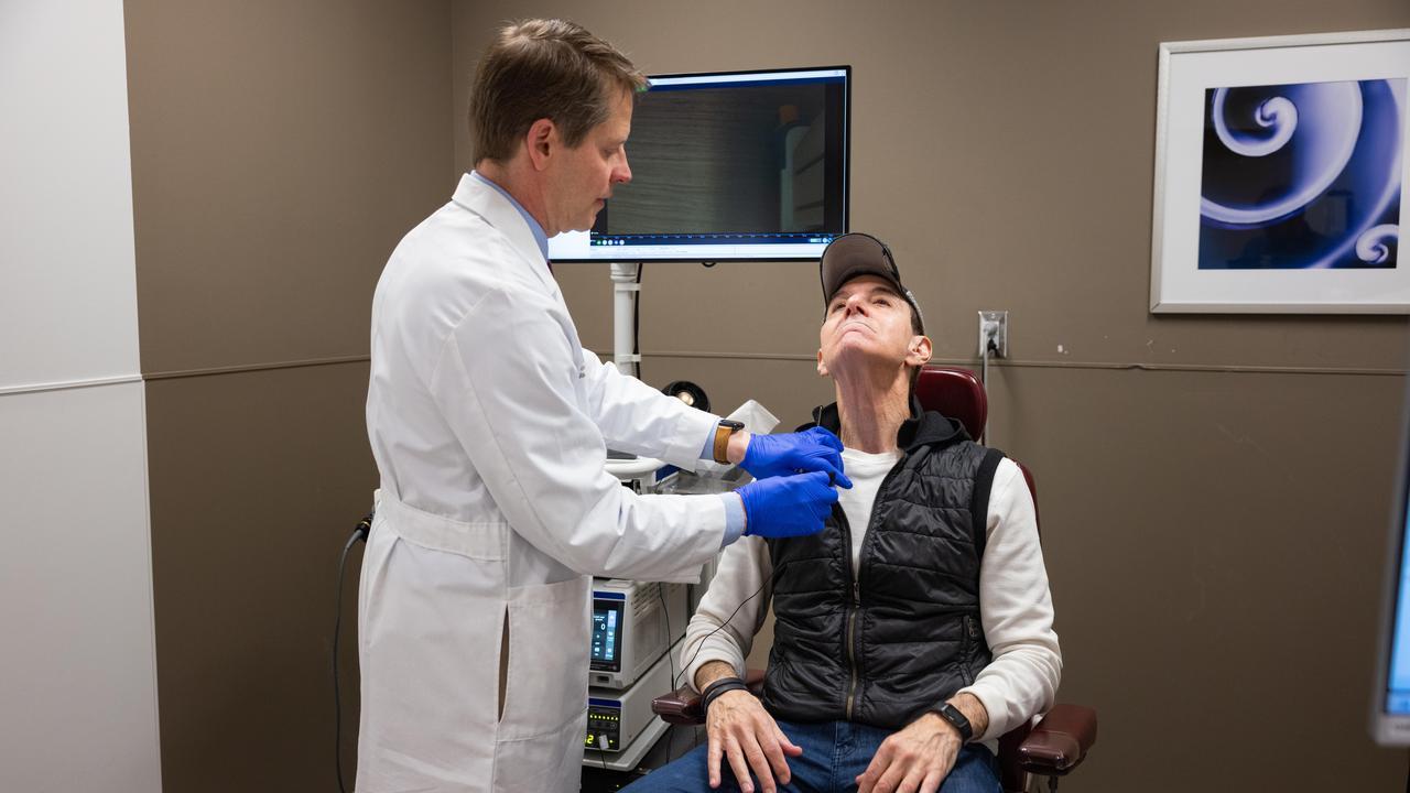 Dr. Friedman examines Johnny B's throat. 