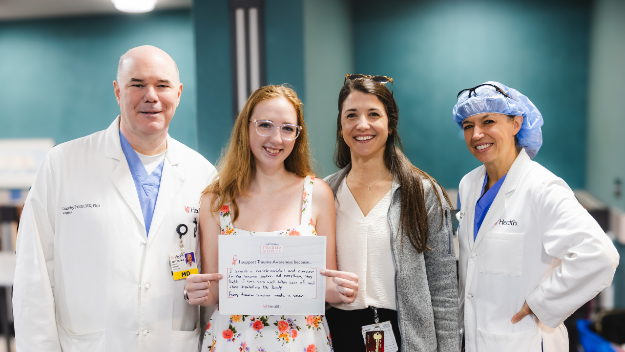 Brittany Childres smiles with her UC Health care team