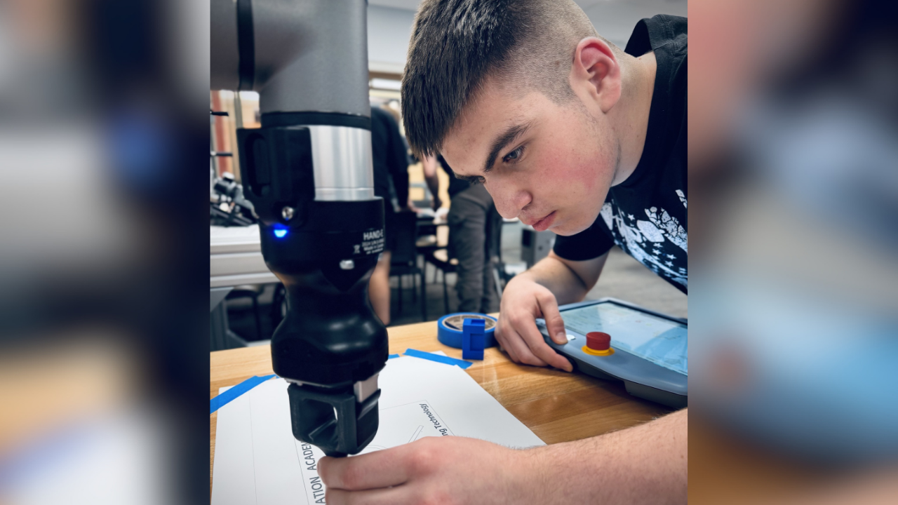 Deklan using a tool during class in the mechanical engineering program.