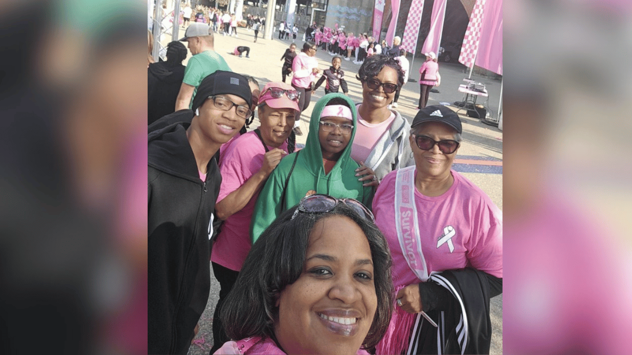 Donna and her supporters smile together at the American Cancer Society Making Strides Against Breast Cancer Walk in October 2025