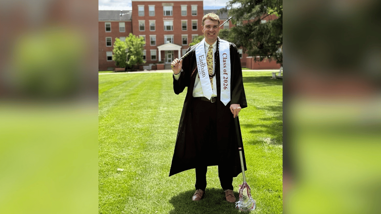 EJ smiles during his graduation photo
