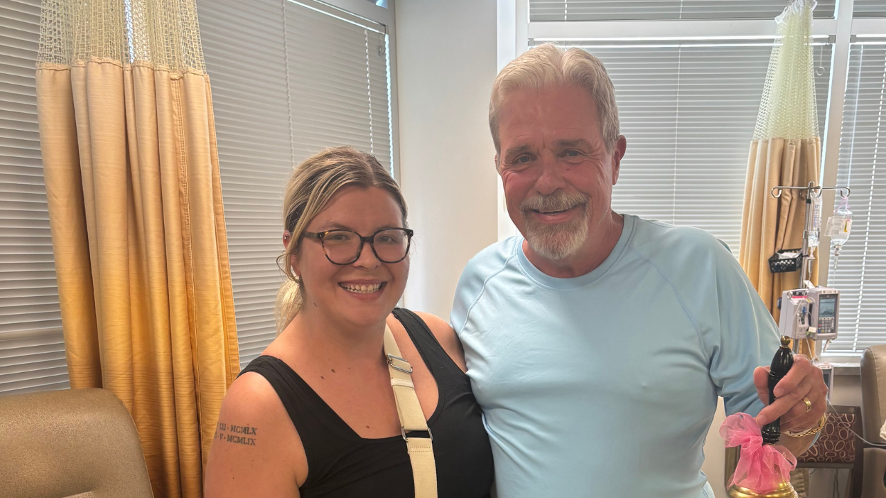 David and his daughter, Rachel, smile together at his last chemotherapy treatment session at the University of Cincinnati Cancer Center.