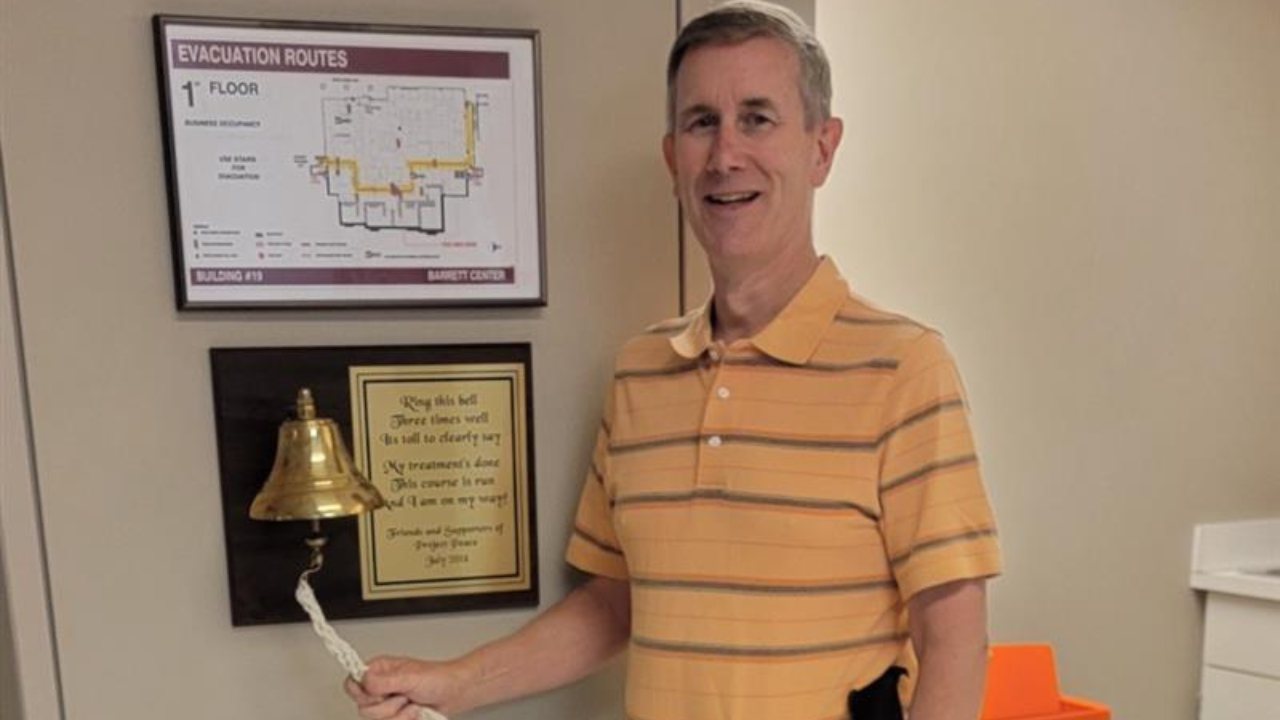 Greg Smallwood rings a bell signaling end of his cancer treatments