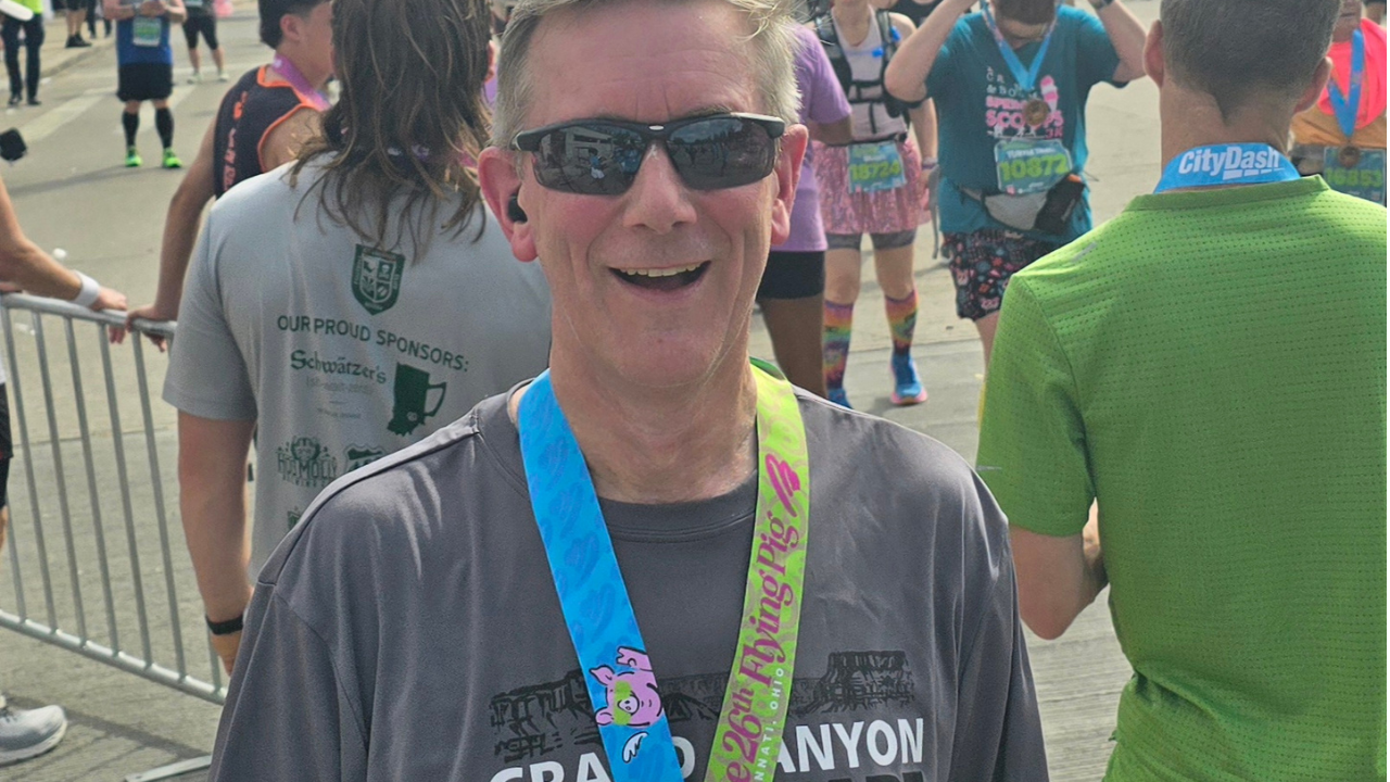 Greg smiles for camera after Flying Pig marathon