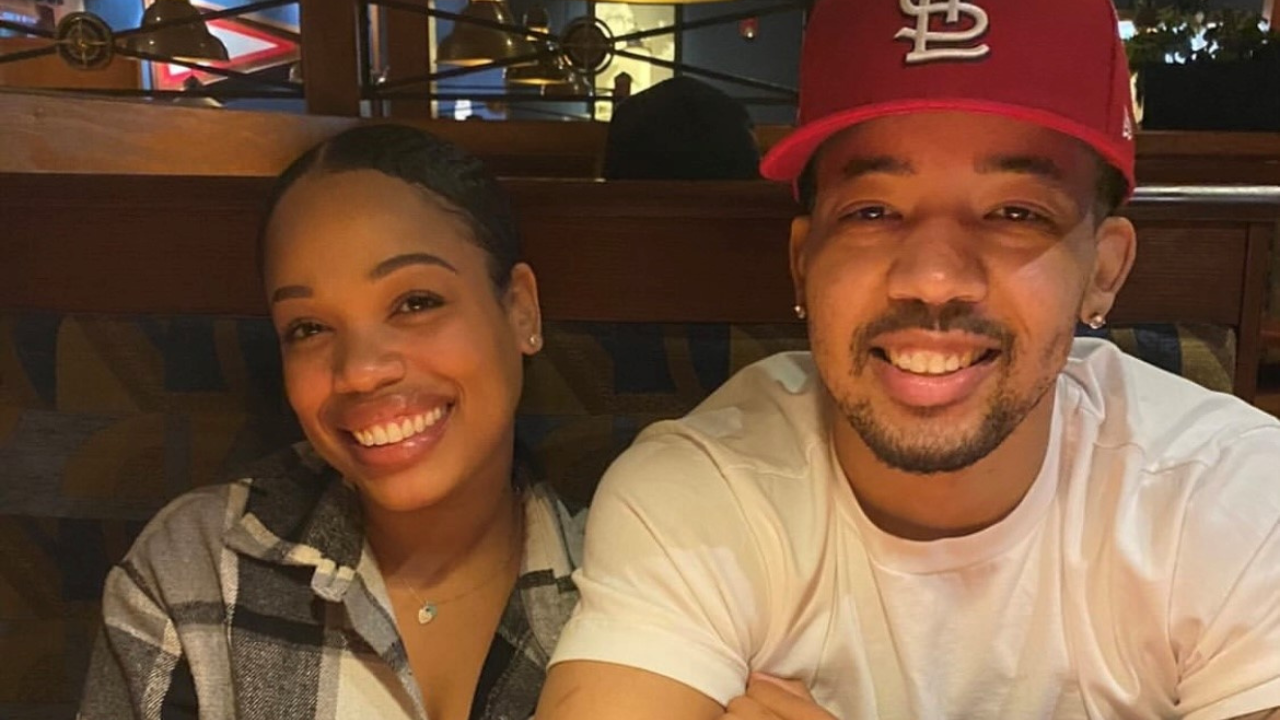 Janae and Brandon smile for a photo together