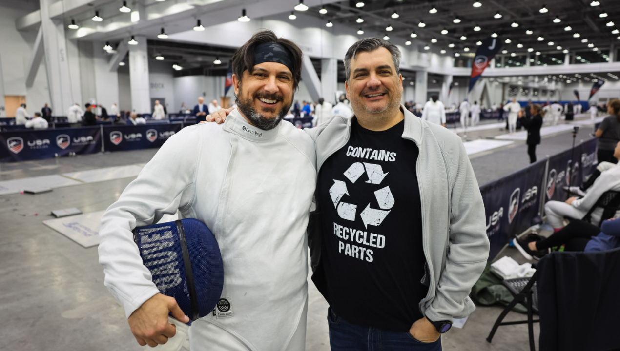 Ken and Matt Gauvey smile together at Ken's fencing tournament after Ken donated his kidney to his brother