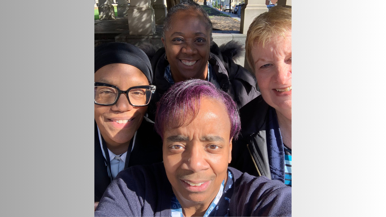 Kim and her friends smile for a selfie