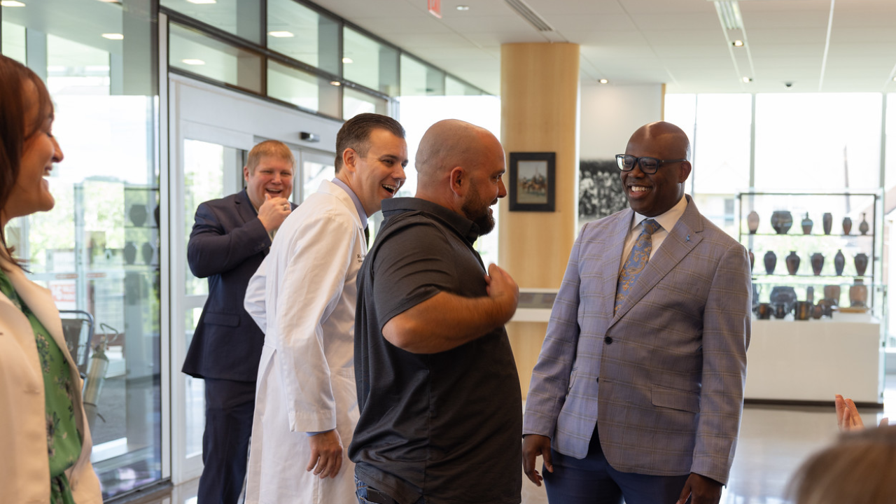 The Knott family and the UC Health Transplant team share a laugh while reuniting at UC Health in Cincinnati