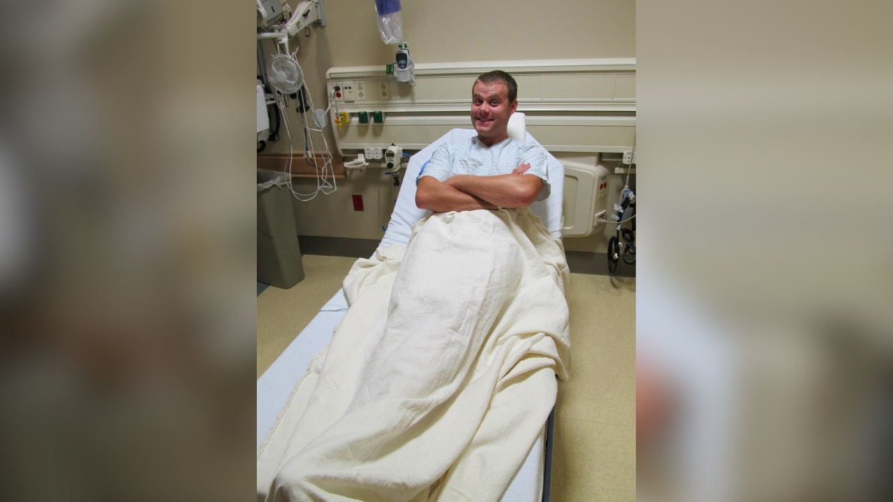 Kurtis laying on a hospital bed