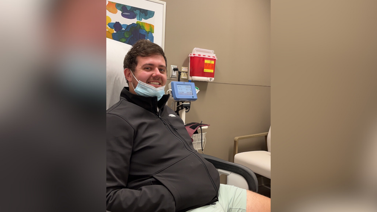 Mason smiles in an patient exam room before a consultation with his Neurosurgery team.