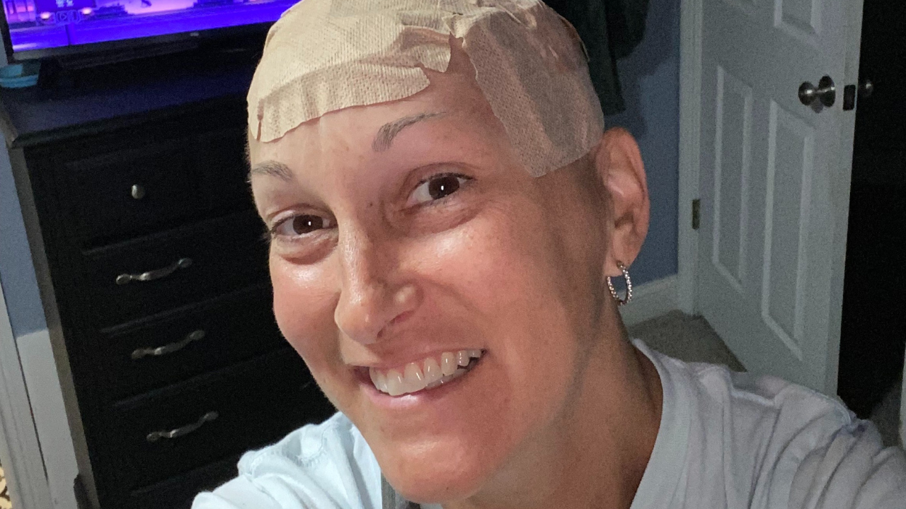 Patty Young smiles for a selfie after treatment