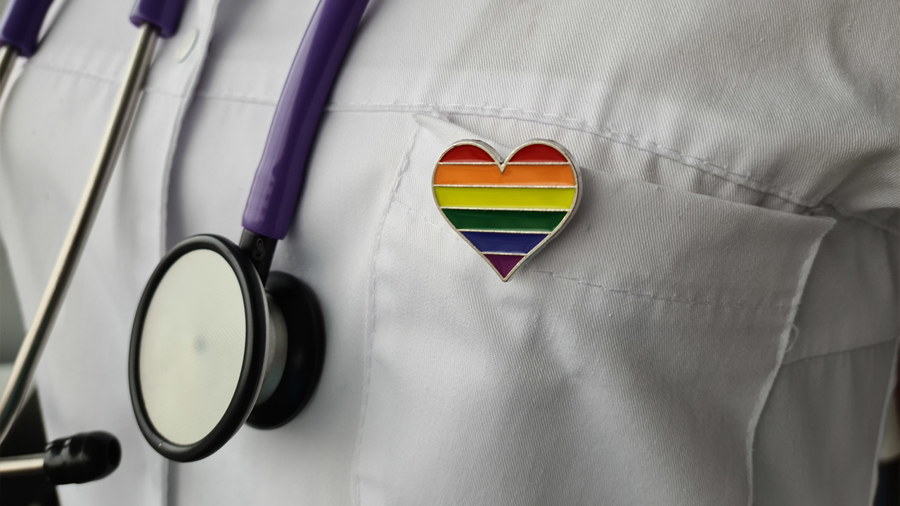 Physician jacket with rainbow pin