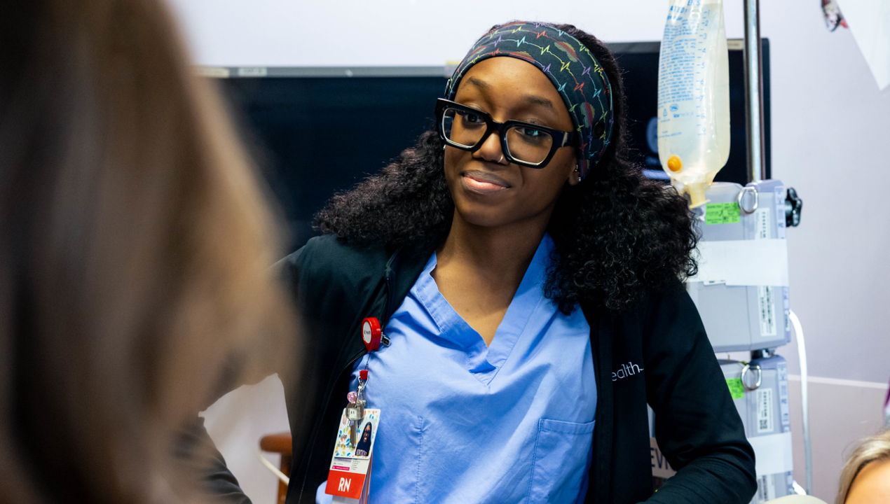 RN at UC Health's West Chester Hospital meets with a patient on maternity floor