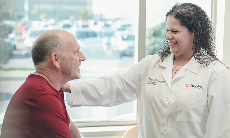 Dr. Dixon talks with a patient. 