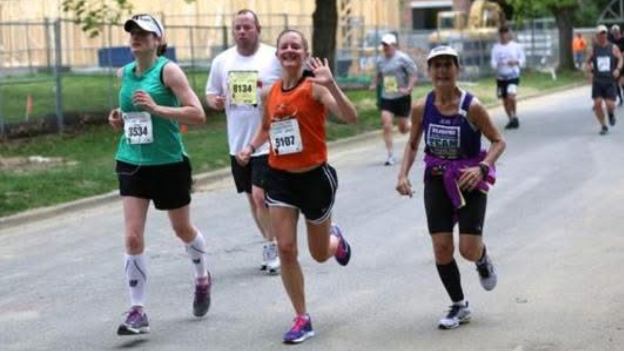 Jean and her daughter run during the 2023 Flying Pig