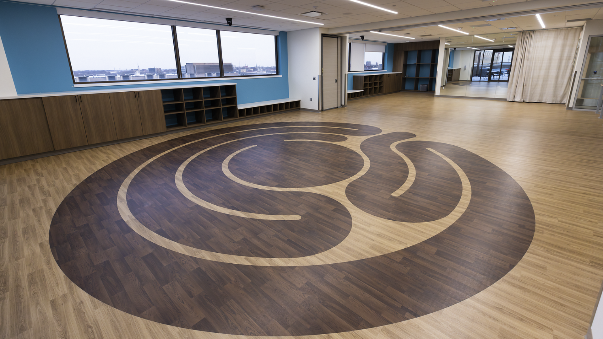 In the Mind-Body-Spirit Wellness studio, participants may gather around an inlaid labyrinth during practices. The studio brings the community together through a variety of classes and programs in Cincinnati, Ohio.