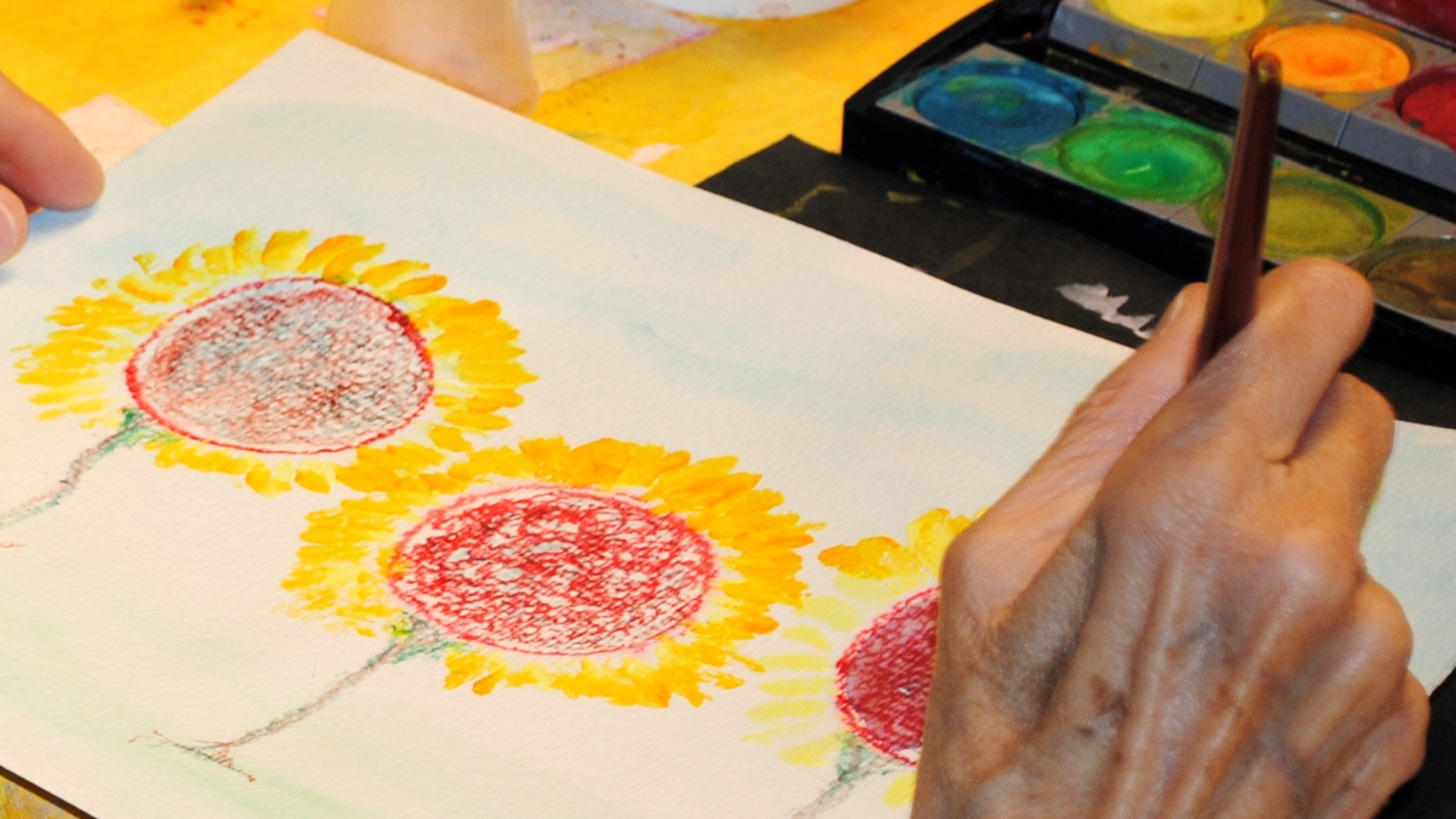 Patient painting sunflowers
