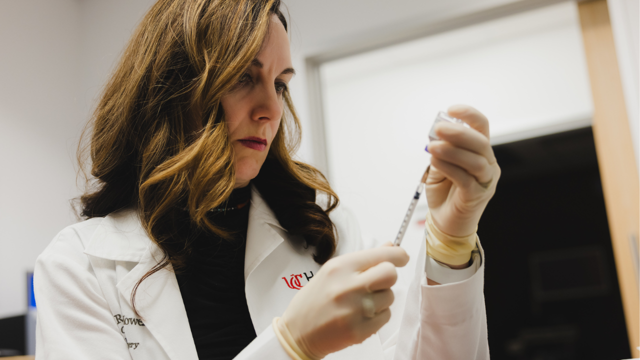 Physician prepares syringe