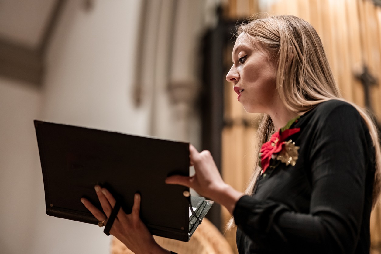 Woman sings in choir