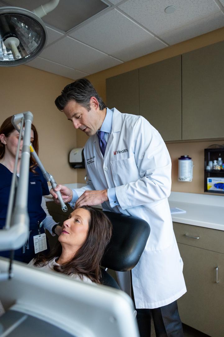 UC Health care team meets with a patient during an appointment at UC Health's Facial Plastics office