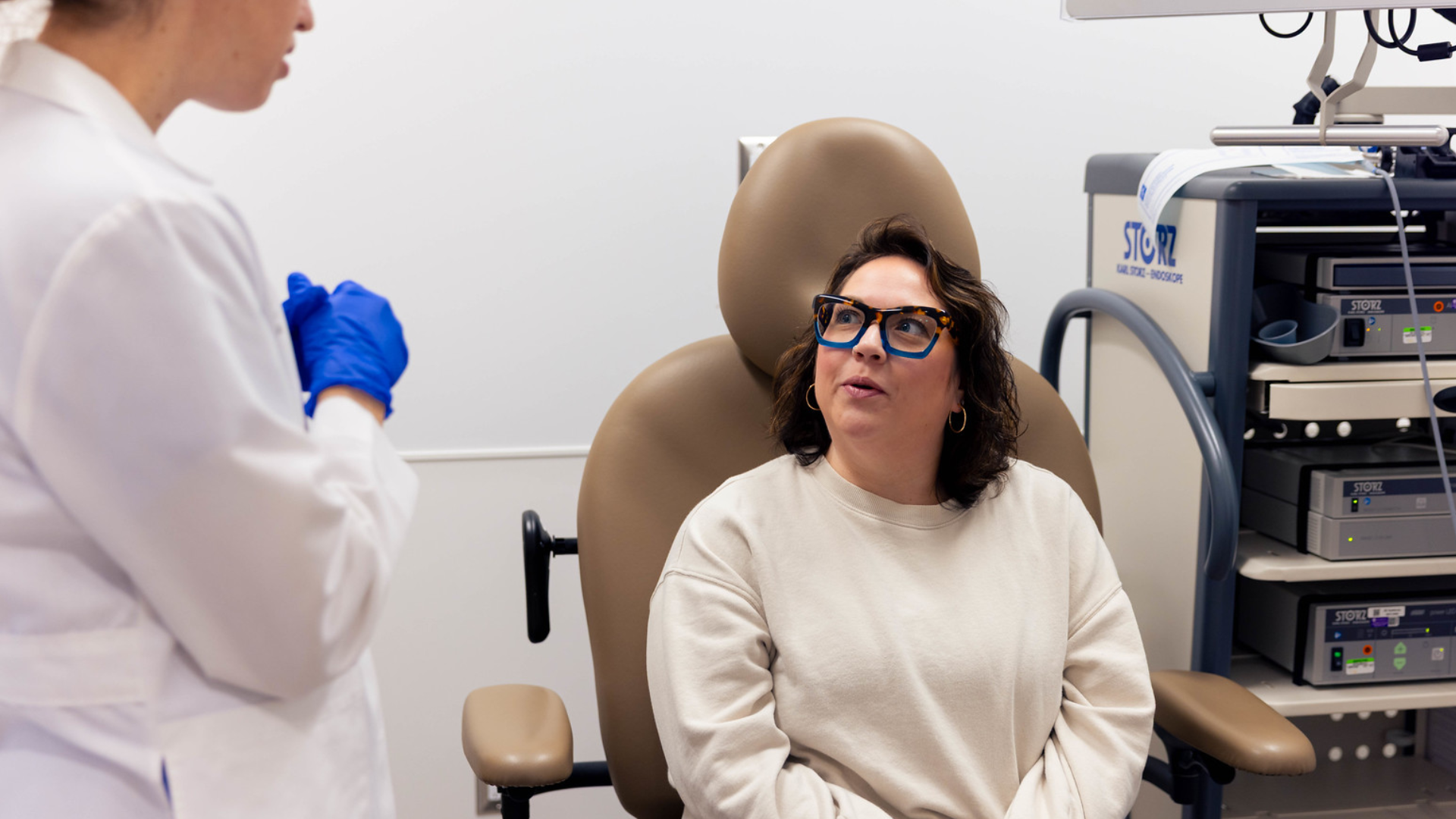 Physician and patient in a medical environment.