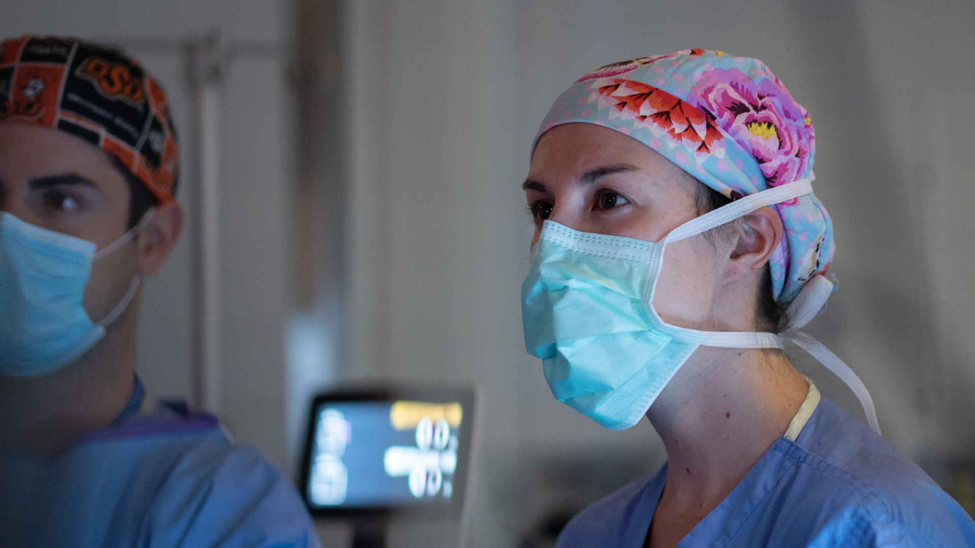Physician talks with a patient in a medical setting.